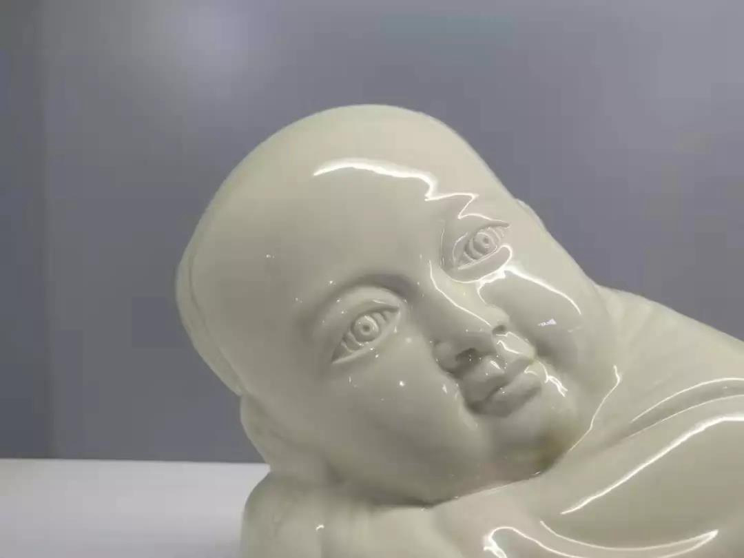 大宋定窯設(shè)計(jì)的孩兒枕的局部 大宋定窯設(shè)計(jì)的孩兒枕的局部